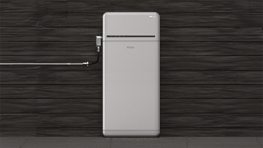 Home energy storage battery mounted on a dark wooden wall, representing stored solar power for nighttime and peak-hour use.