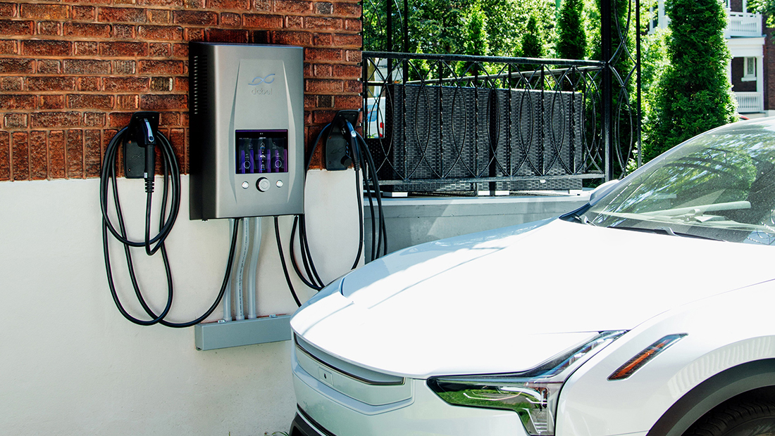 Electric vehicle connected to a sleek wall-mounted Ara charger with dual cables, illustrating EV battery charging, energy storage, and smart home integration for backup power and energy independence.